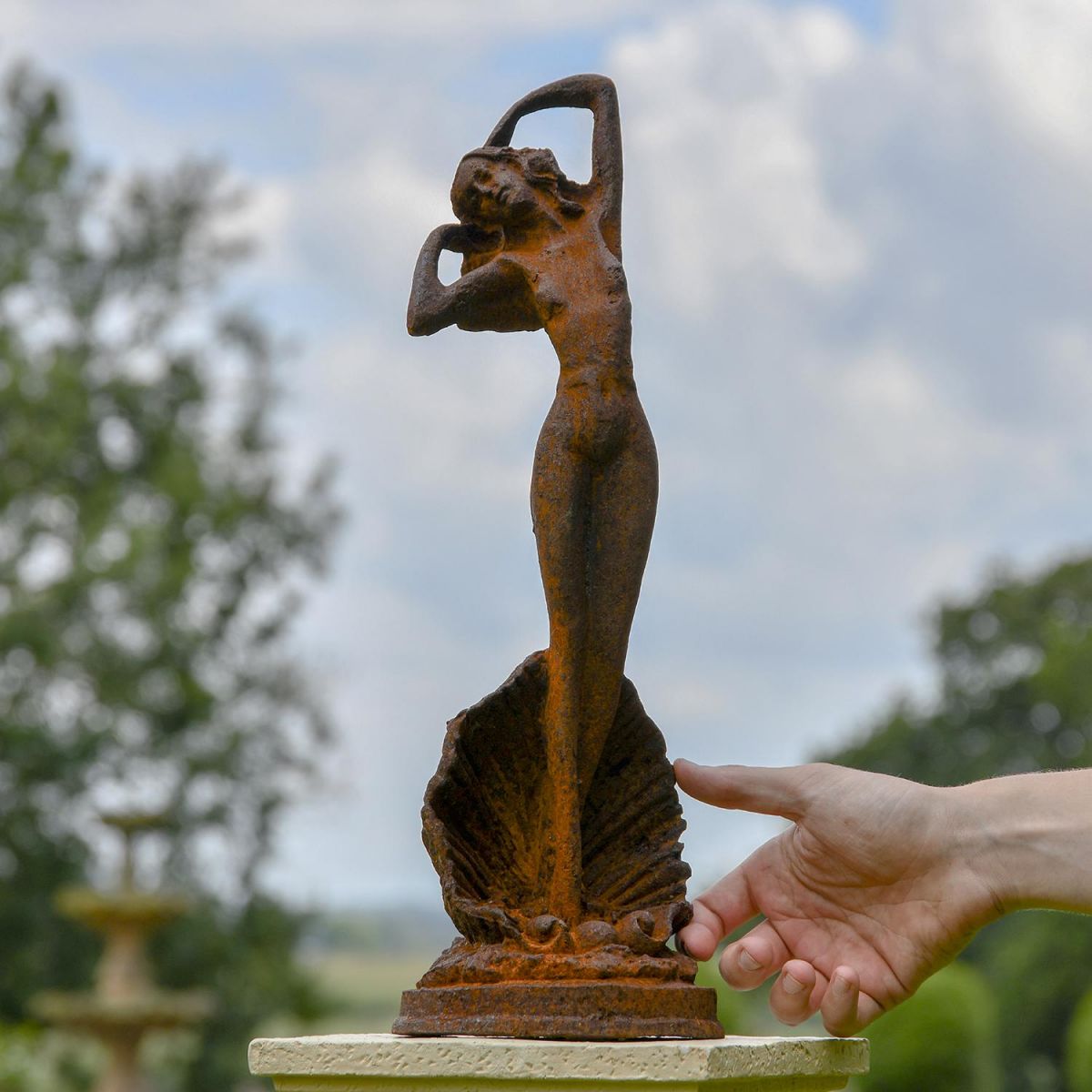 Lady Standing on Clam Sculpture to Scale
