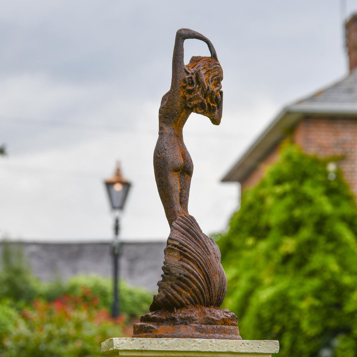 View of the Back of the Lady Standing on Clam Sculpture