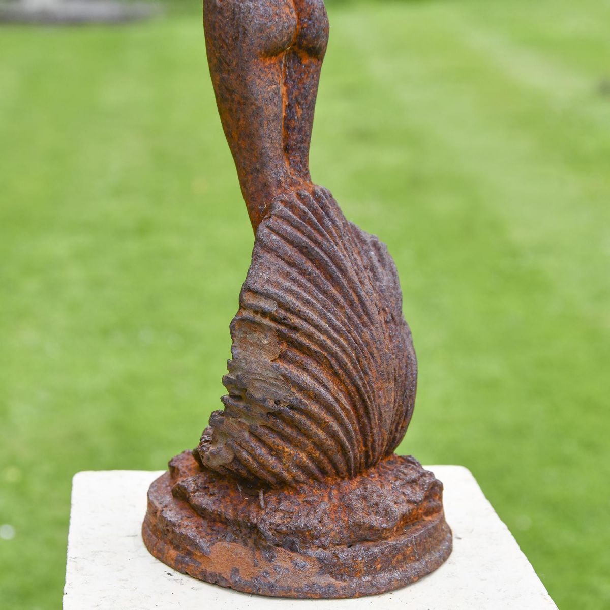 Close-up of the Base of the Lady Standing on Clam Sculpture