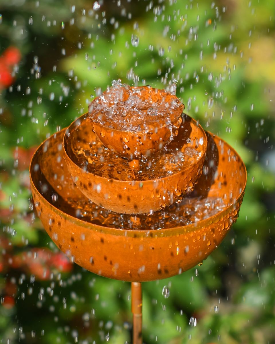 Close up of three tiered rustic finish garden ornament