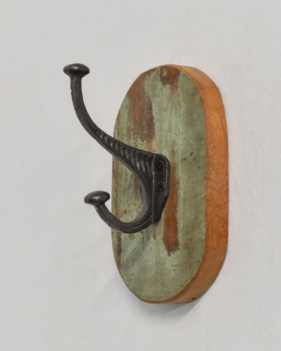 Rustic Wood And Iron Coat Hook, oval in green