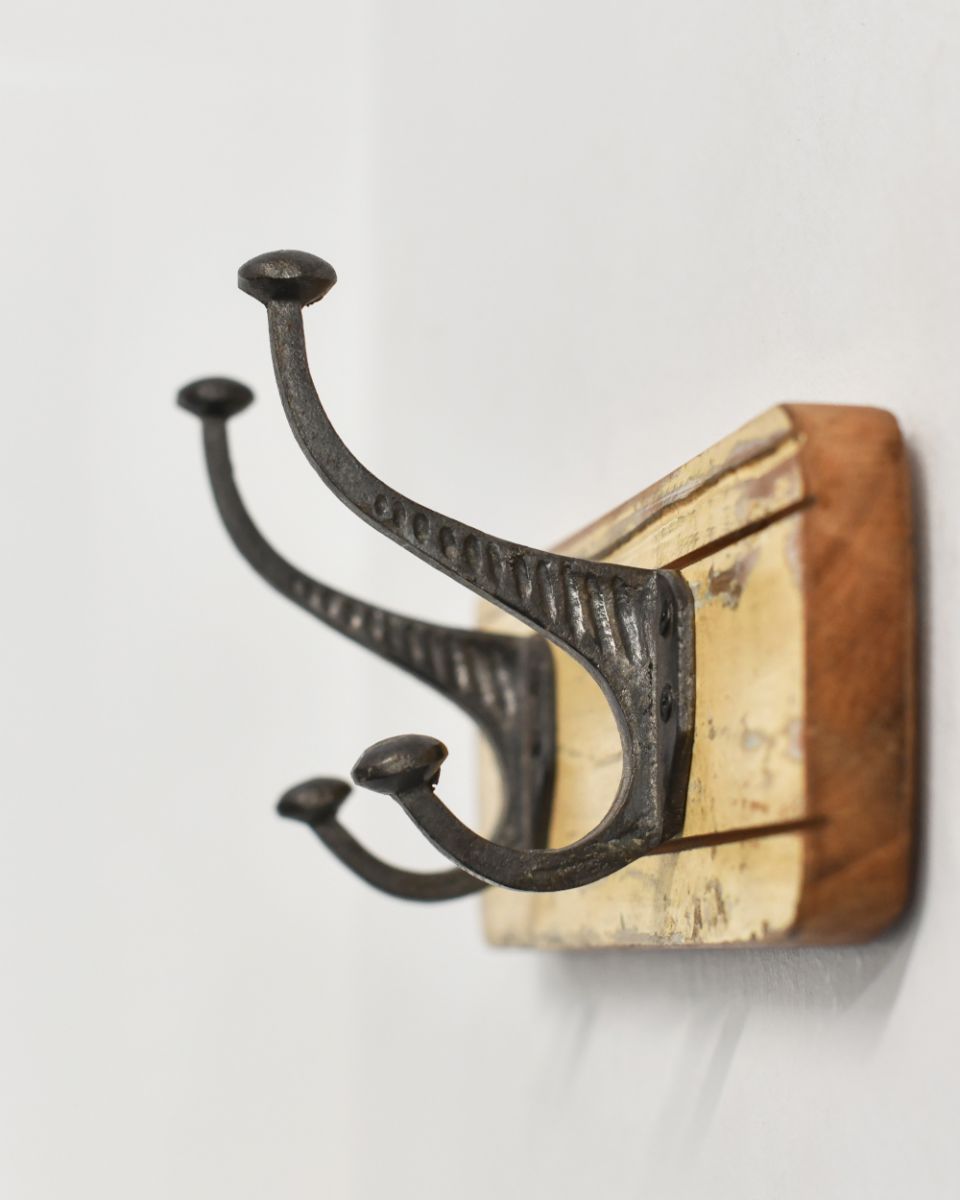 Side view of the Rustic Wood And Iron Coat Hooks in yellow