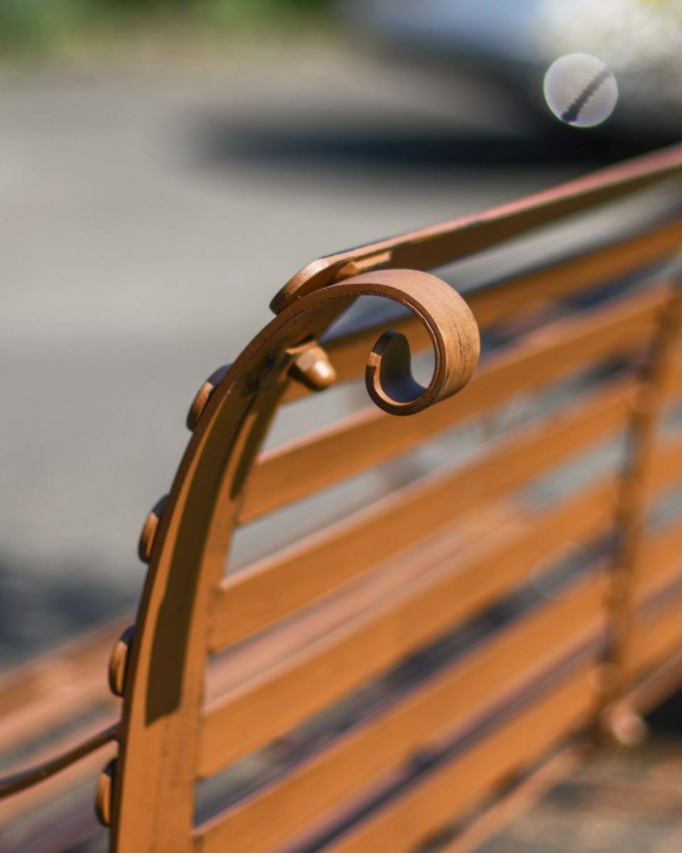 Close-Up of Ornate Pattern for Rustic Wrought Iron “Chatham" Two Seater Garden Bench