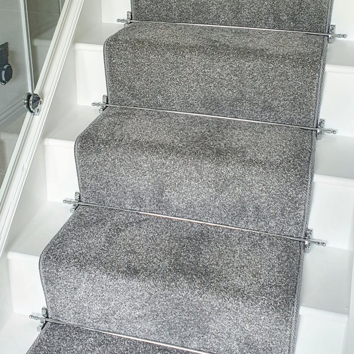 Close-up of the Ball Finial Bright Chrome Stair Rods in Use