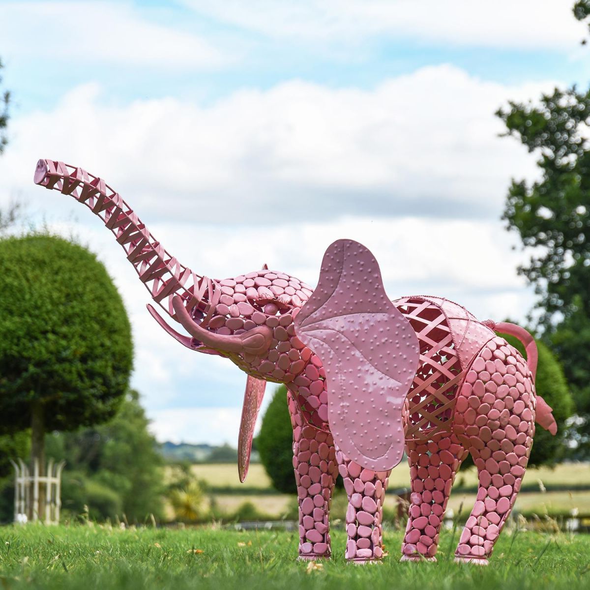 "Sambaku" Pink Garden Elephant Sculpture in Use in the Garden "Sambaku" Pink Garden Elephant Sculpture in Use in the Garden