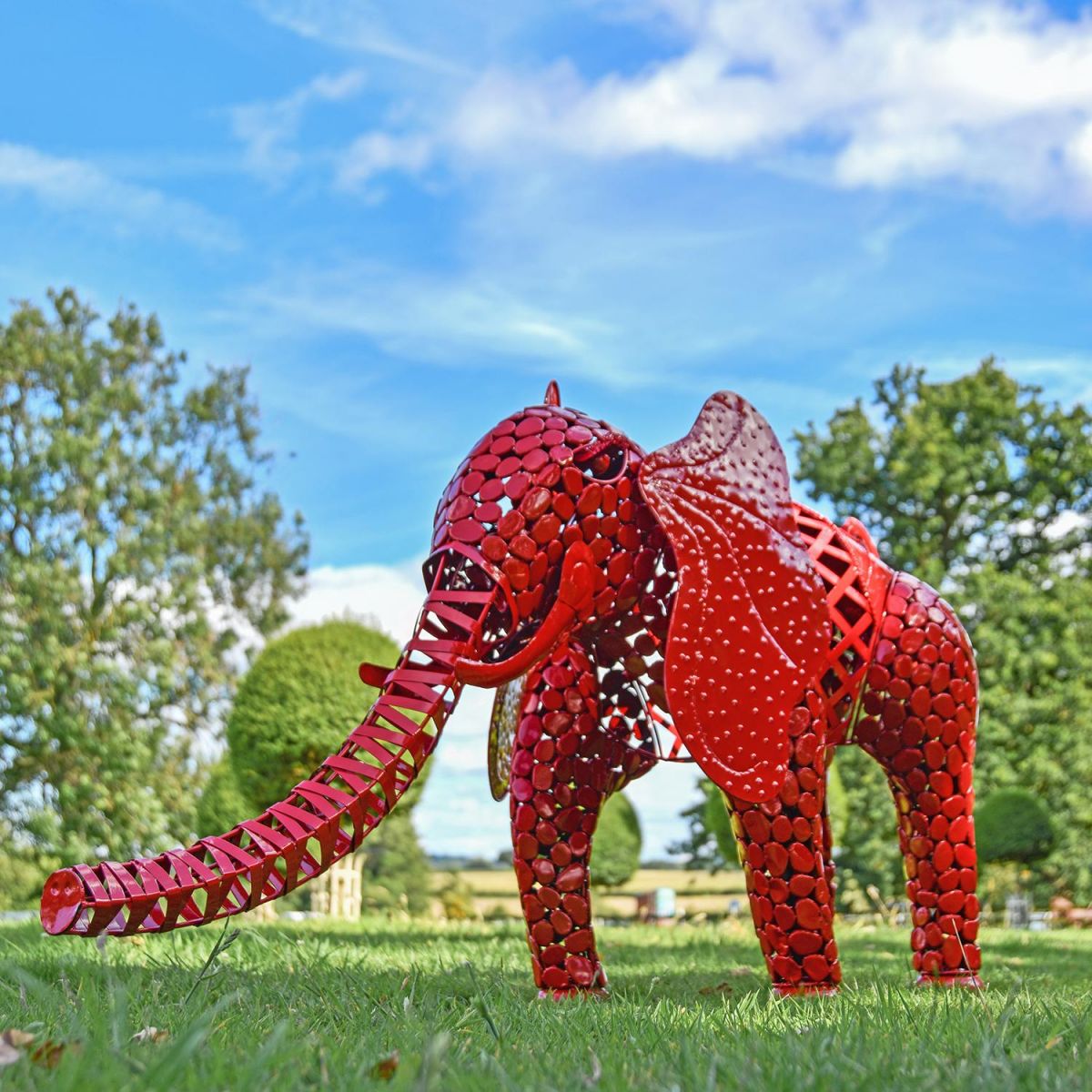"Sambaku" Red Garden Elephant Sculpture in Use in the Garden "Sambaku" Red Garden Elephant Sculpture in Use in the Garden