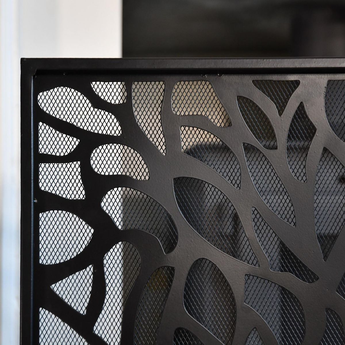Close up of mesh netting and black finish on fire screen Close up of mesh netting and black finish on fire screen