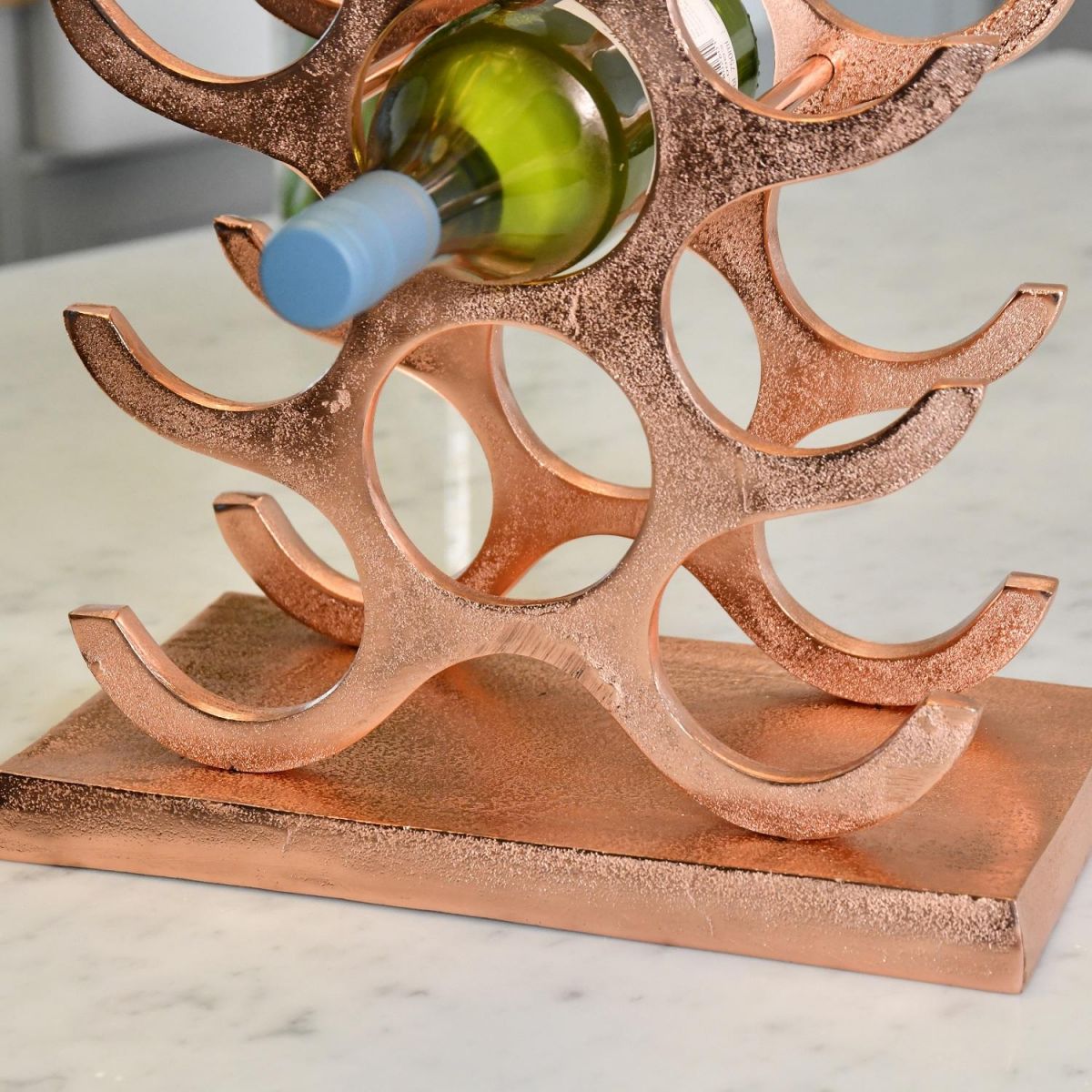 Close up of rectangular base on Copper "Tree" Wine Rack 
