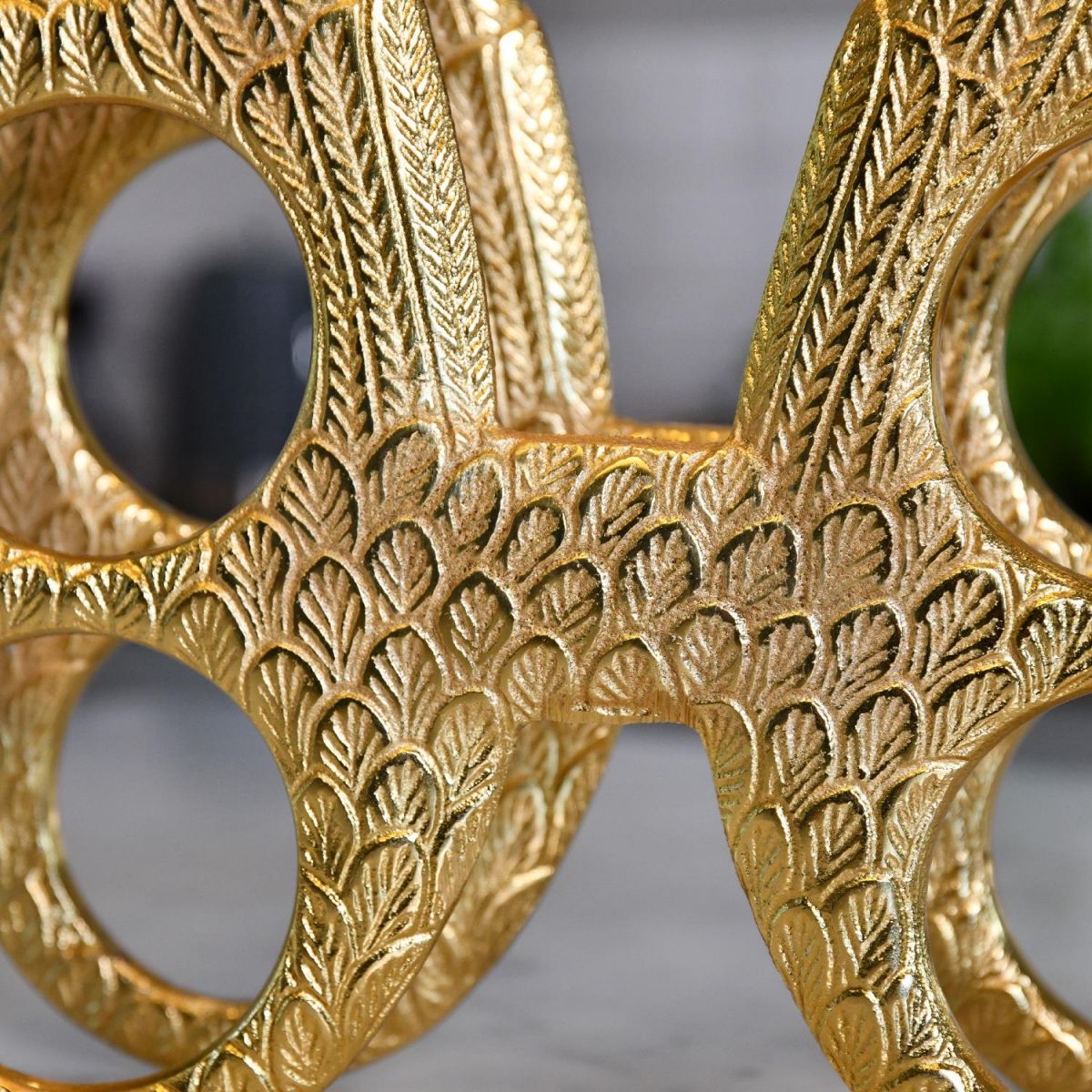 Close up of detailing within centre part of "Angel Wings" Wine Rack 