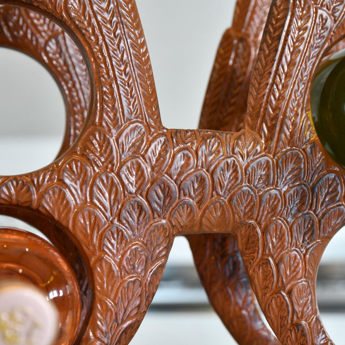 Close up of detailing within centre part of "Angel Wings" Wine Rack  Close up of detailing within centre part of "Angel Wings" Wine Rack