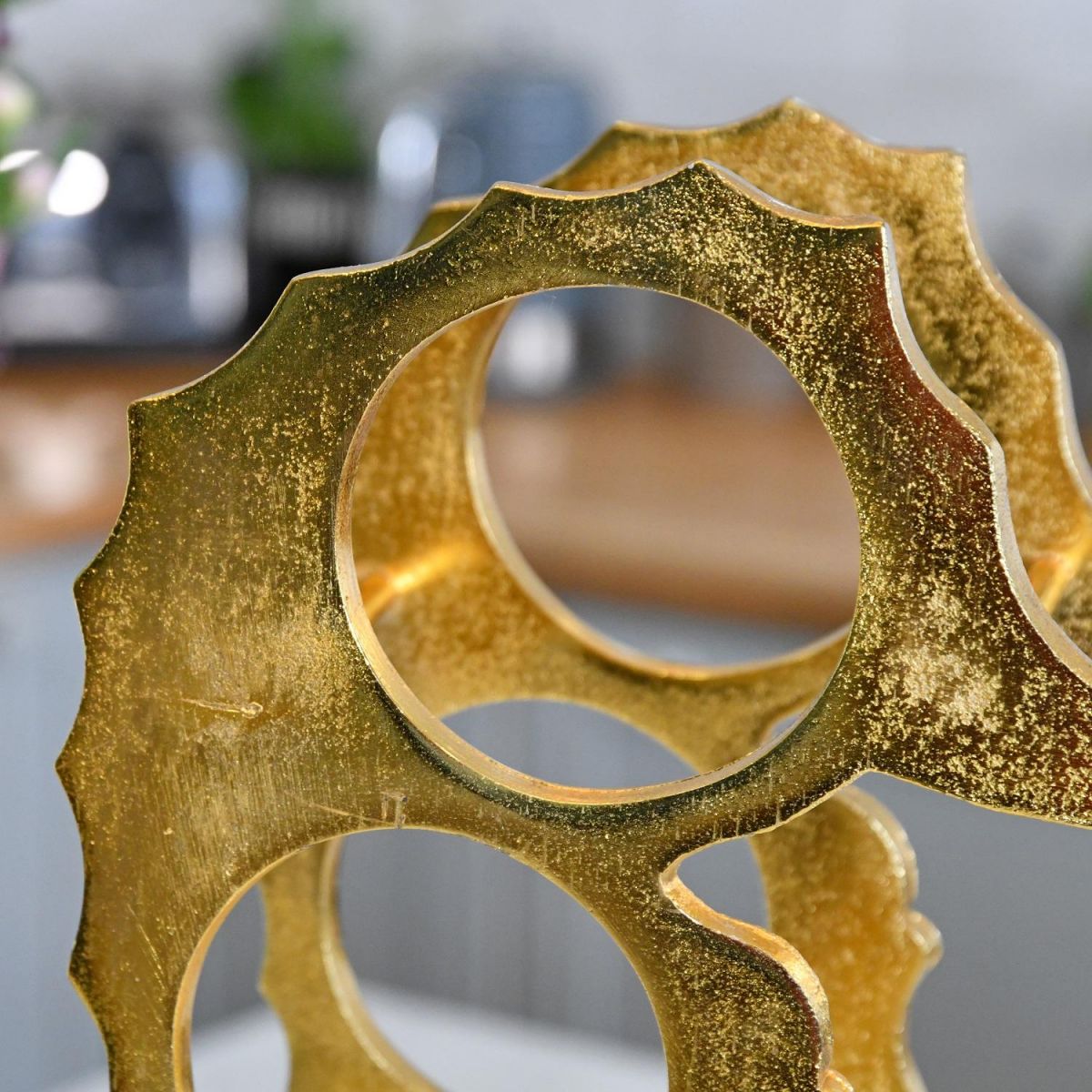 Close up of Gold "Seahorse" Wine Rack 