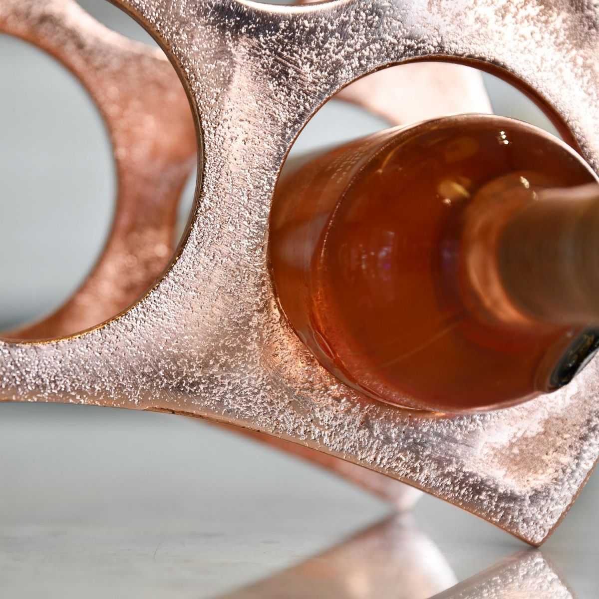 Close up of wine rack with bottle in situ 