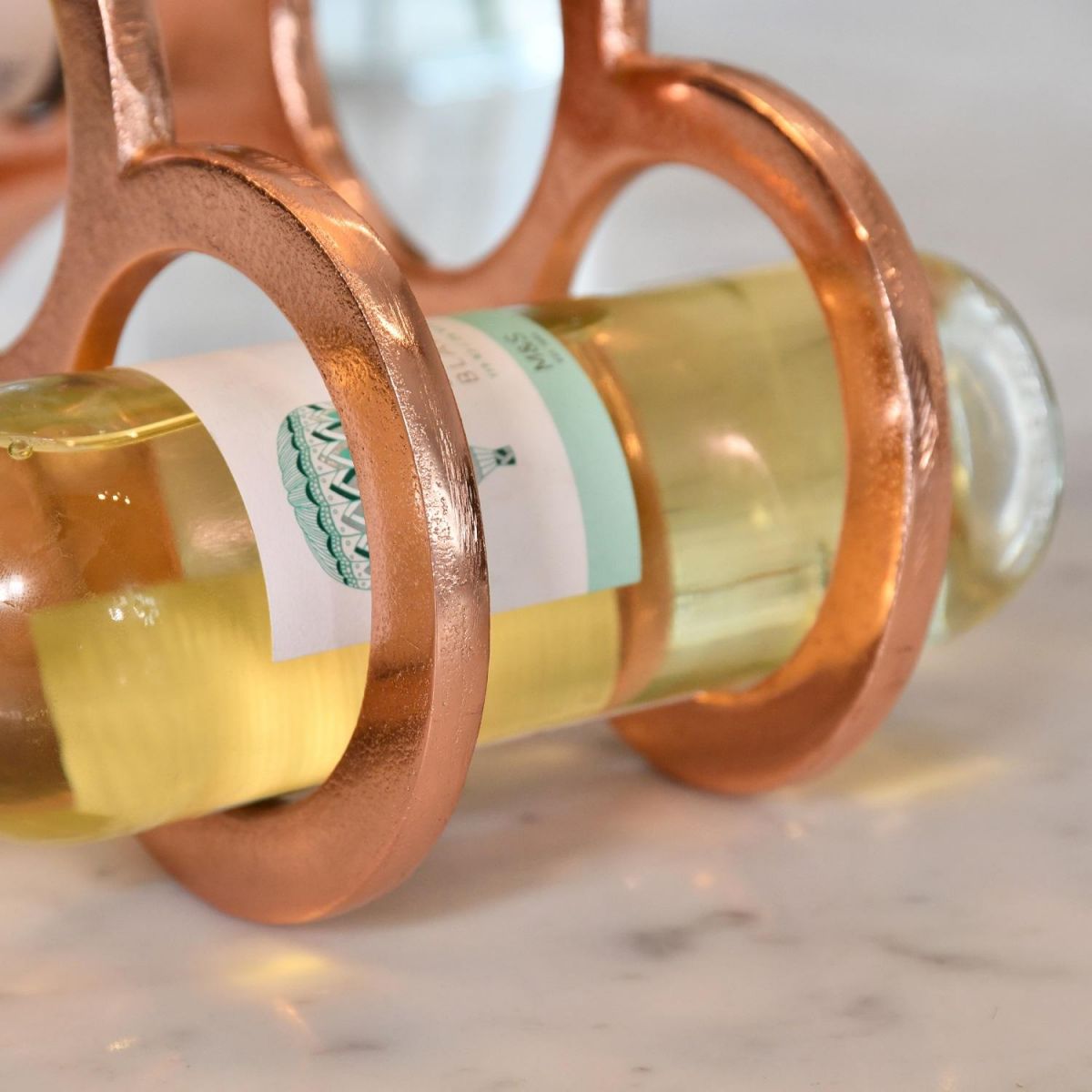 Close up of copper finish and wine bottle holder 