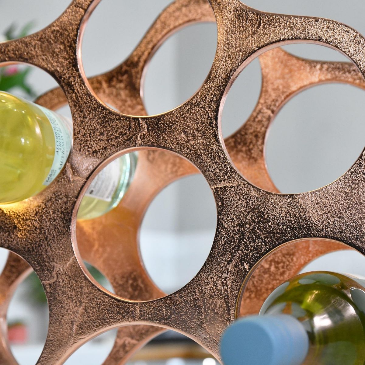 Close up of circular bottle holders within "Cloud" Wine Rack 