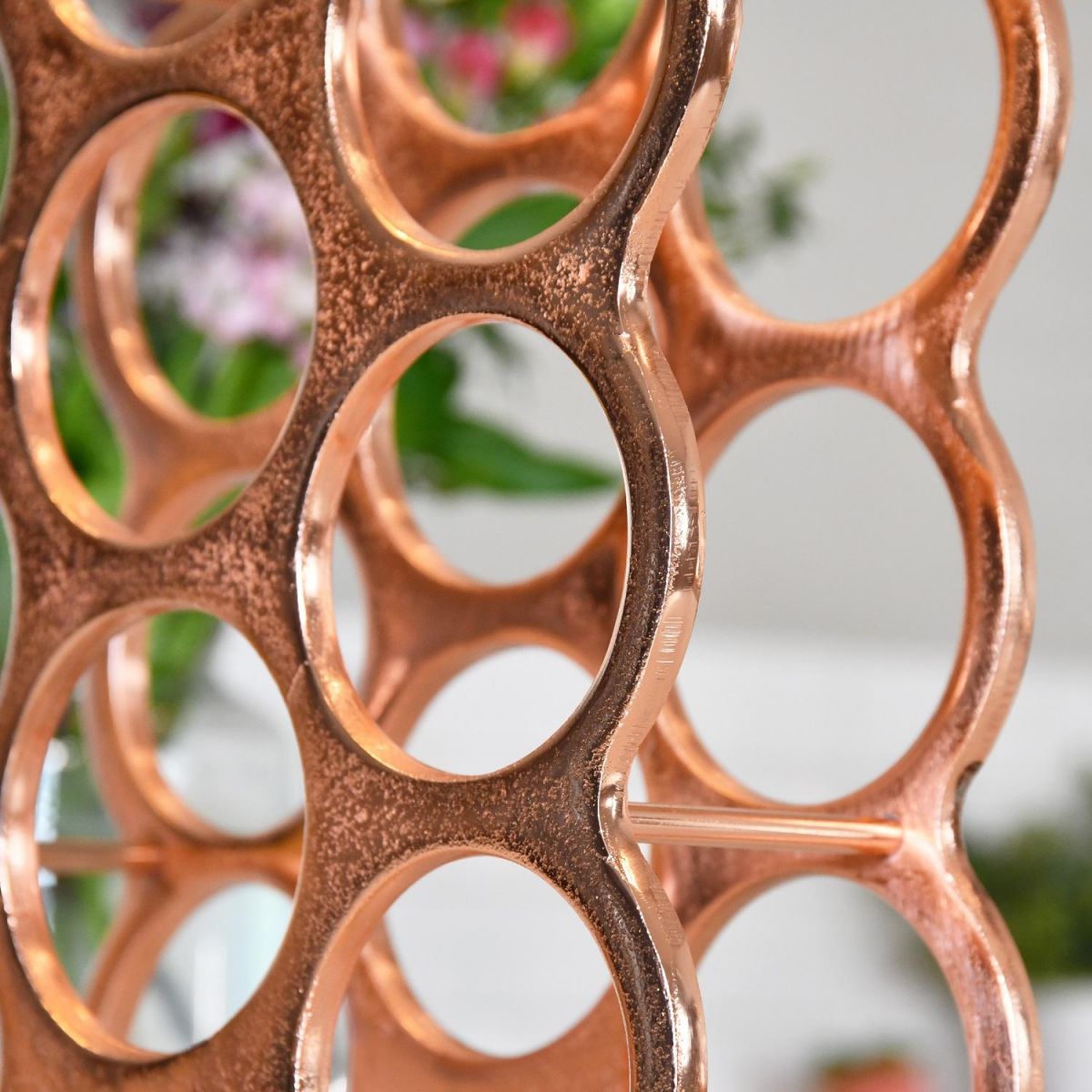 Close up of bottle holders within "Floating Bubbles" Wine rack 