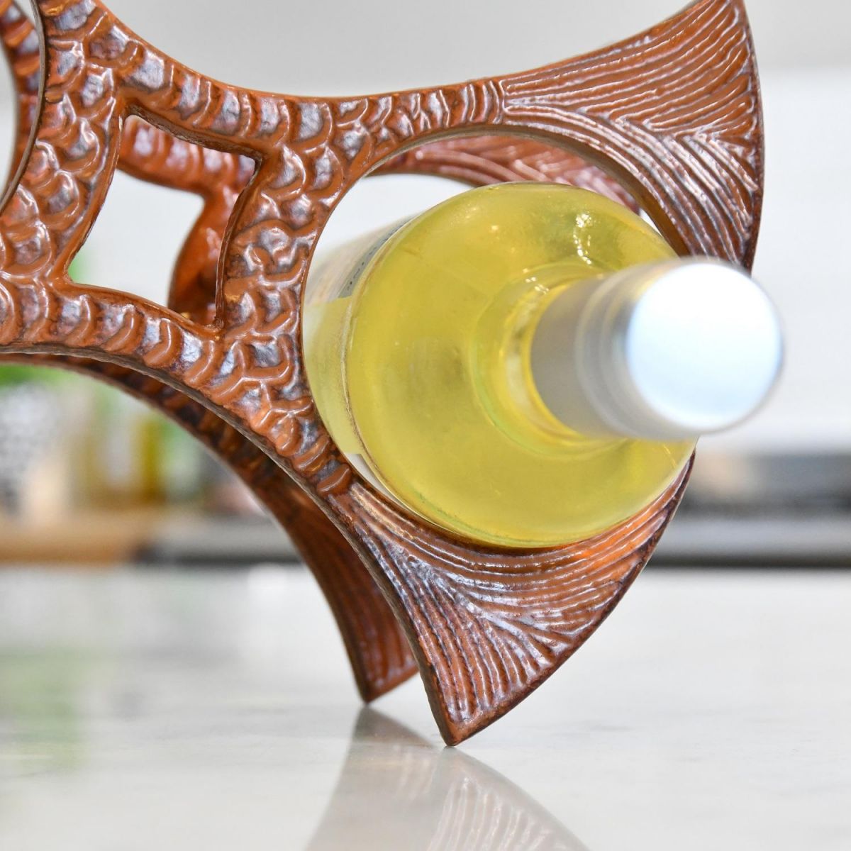 Close up of bottle holder on "fish" wine rack 