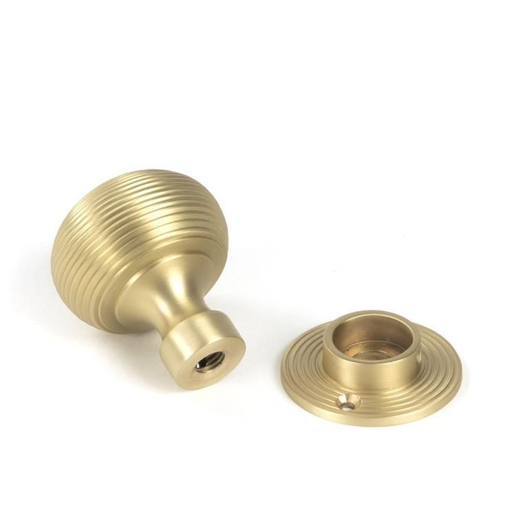 Close-Up of Satin Brass "Beehive" Mortice & Rim Doorknob Set with Fittings