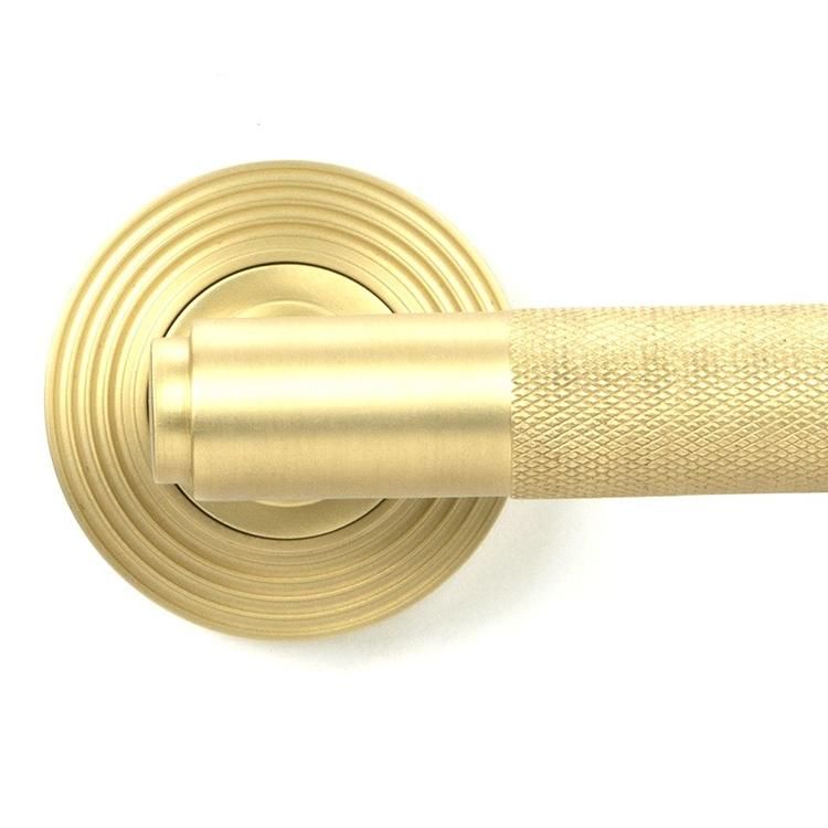 Close-Up of Satin Brass "Royale" Beehive Concealed Door Handle on Rose Set Close-Up of Satin Brass "Royale" Beehive Concealed Door Handle on Rose Set