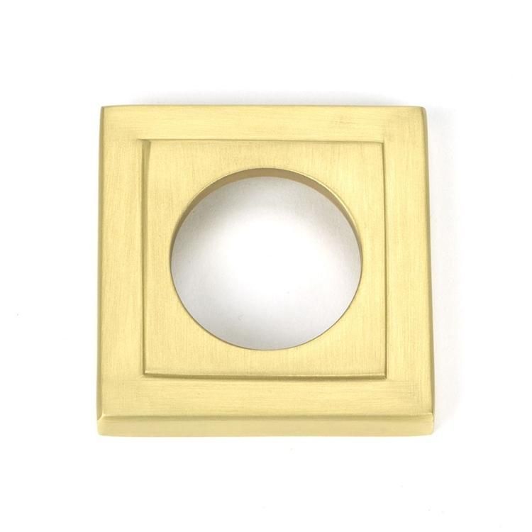 Close-Up of Square Backplate on Satin Brass "Royale" Square Concealed Door Handle on Rose Set Close-Up of Square Backplate on Satin Brass "Royale" Square Concealed Door Handle on Rose Set