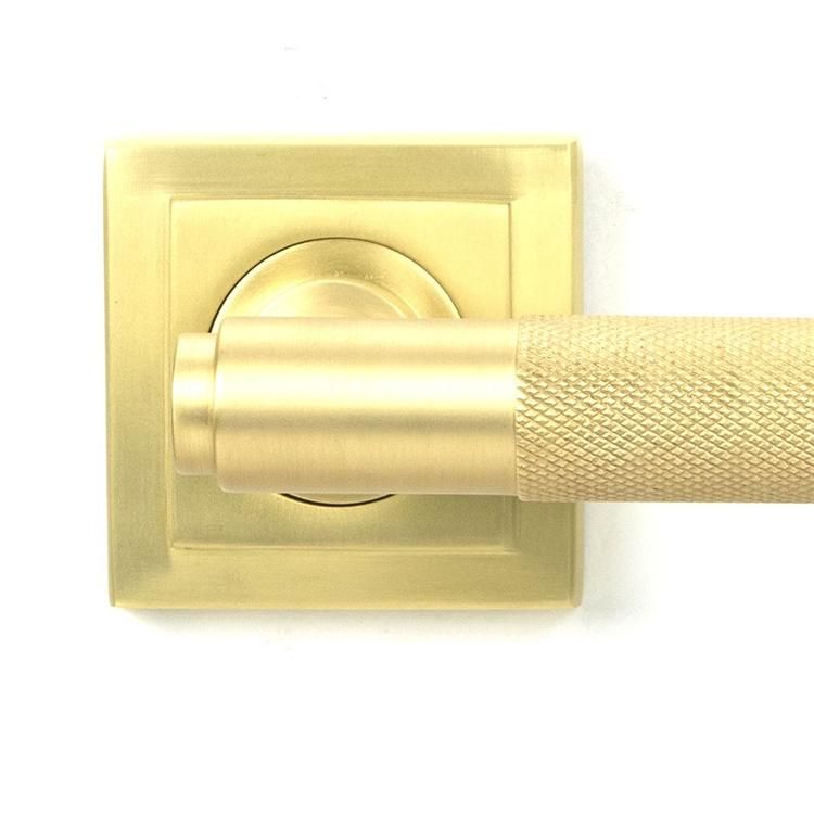 Close-Up of Satin Brass "Royale" Square Unsprung Door Handle on Rose Set Close-Up of Satin Brass "Royale" Square Unsprung Door Handle on Rose Set