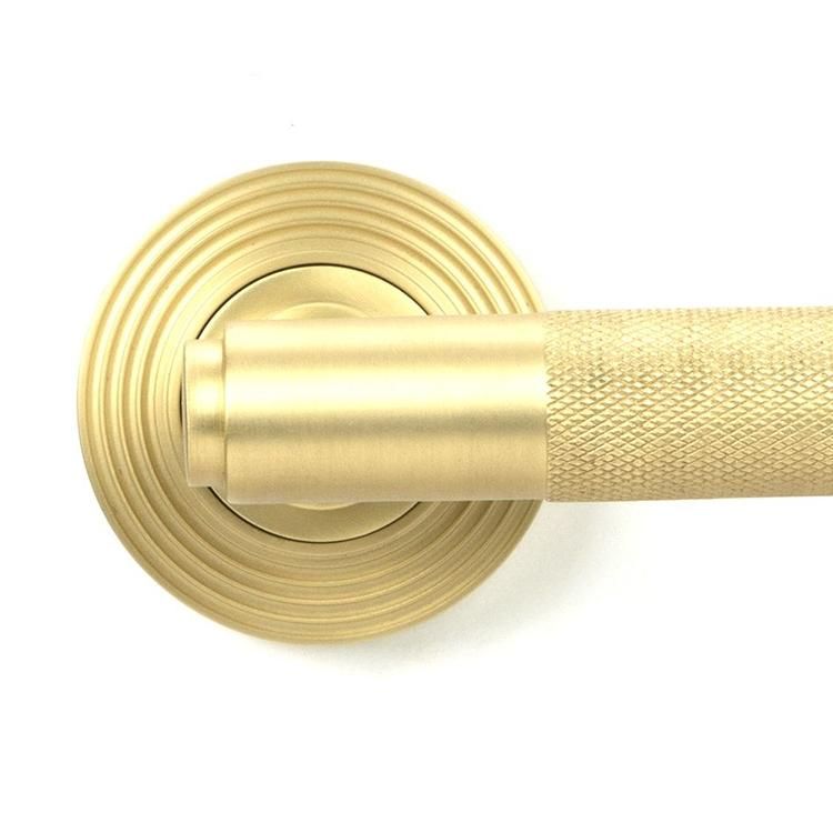 Close-Up of Satin Brass "Royale" Unsprung Beehive Door Handle on Rose Set Close-Up of Satin Brass "Royale" Unsprung Beehive Door Handle on Rose Set