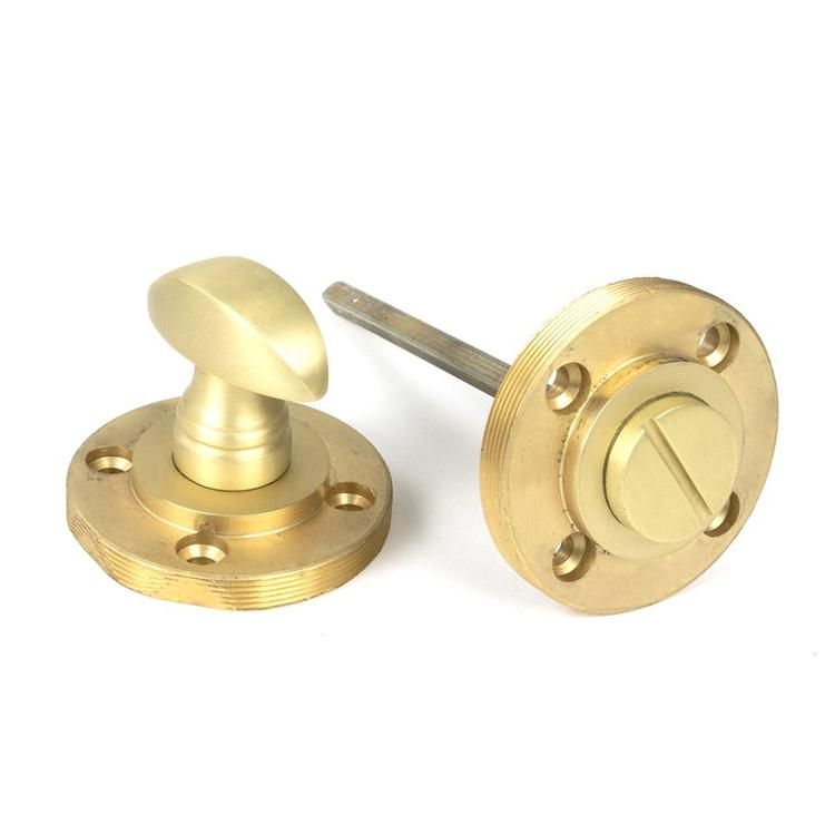Close-Up of Set of Satin Brass Square "Vienna" Round Bathroom Thumb Lock