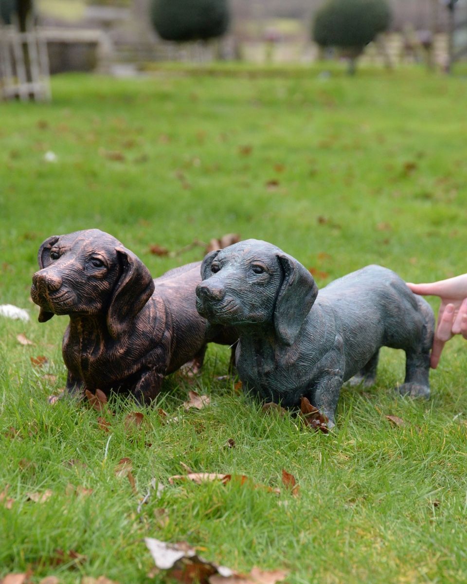 "Rolo" the Sausage Dog Cast Aluminium Garden Sculpture - Copper to scale with hand in shot for reference