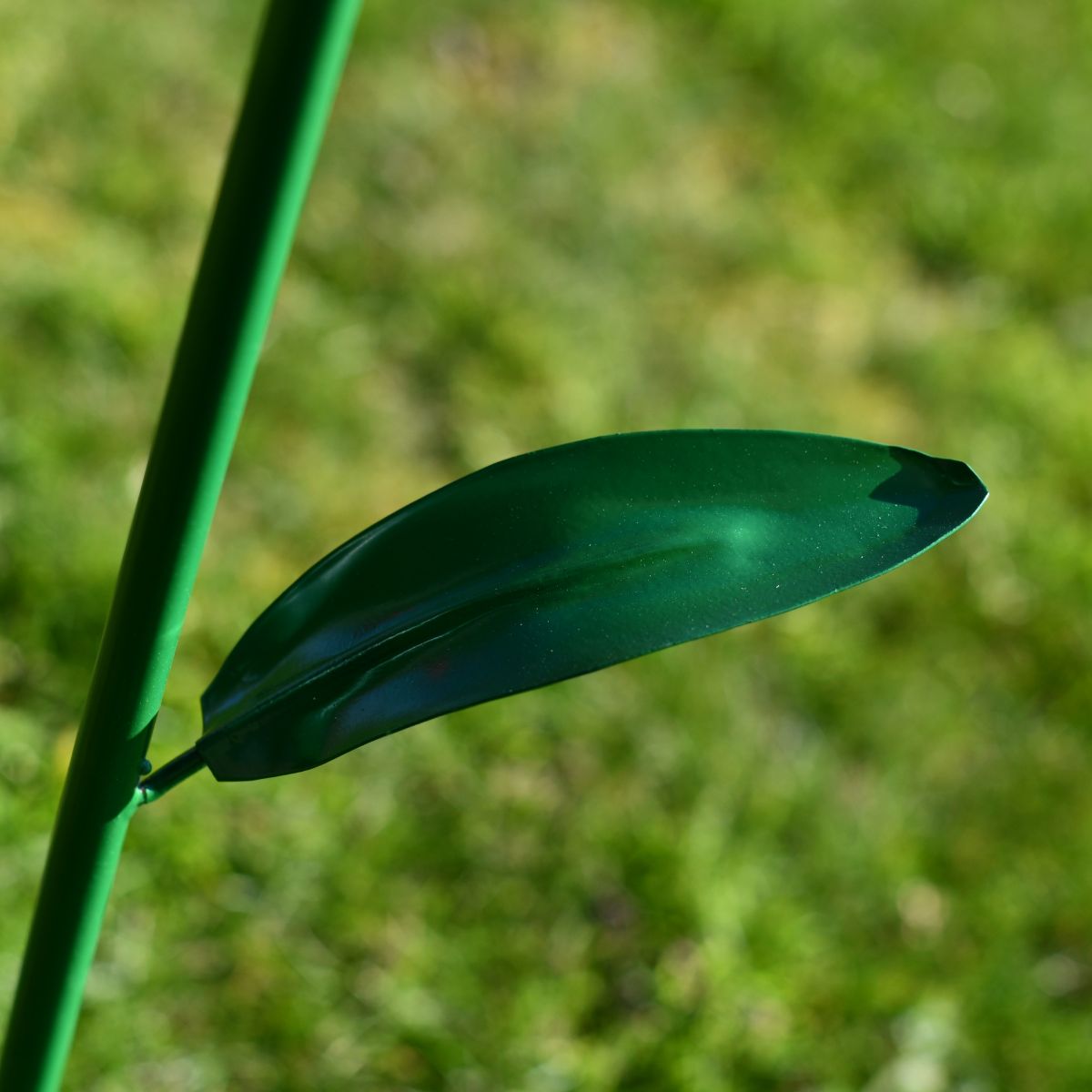Close up of metal leaf on sunflower outdoor ornament Close up of metal leaf on sunflower outdoor ornament