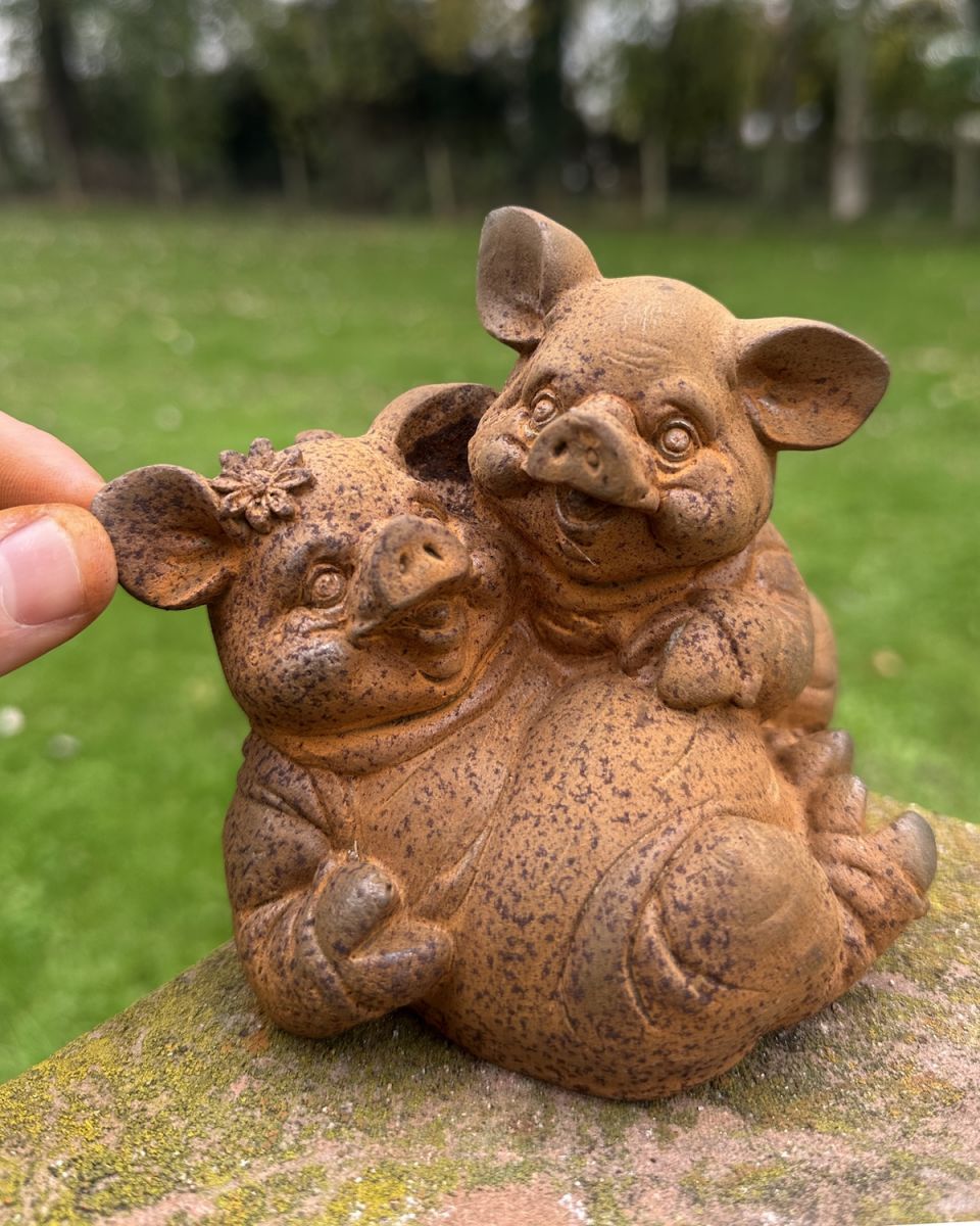 Scale image of cast iron pig outdoor statue