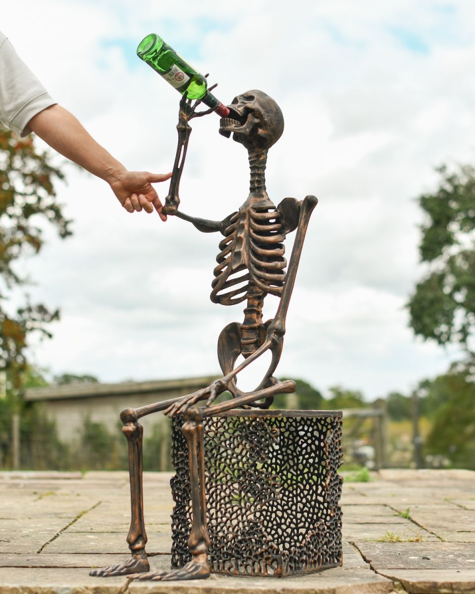 Scale image of copper skeleton garden statue