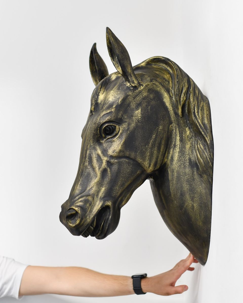 Scale image of black and gold horse head animal bust