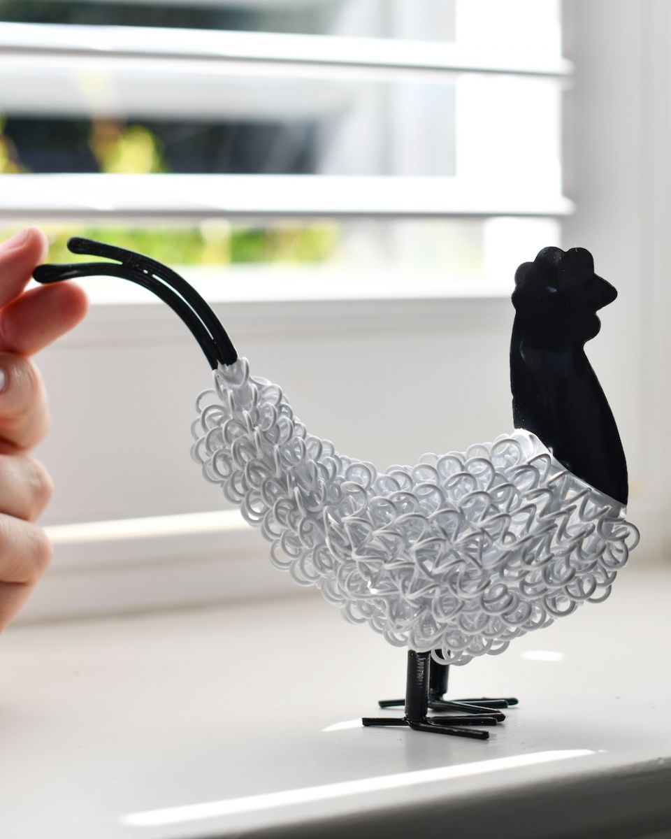 Scale photo of the recycled metal cockerel sculpture