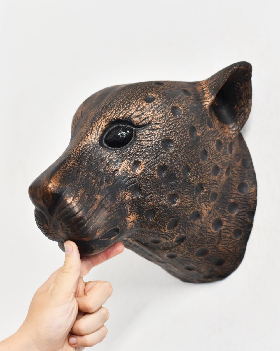 Scale image of copper leopard wall bust
