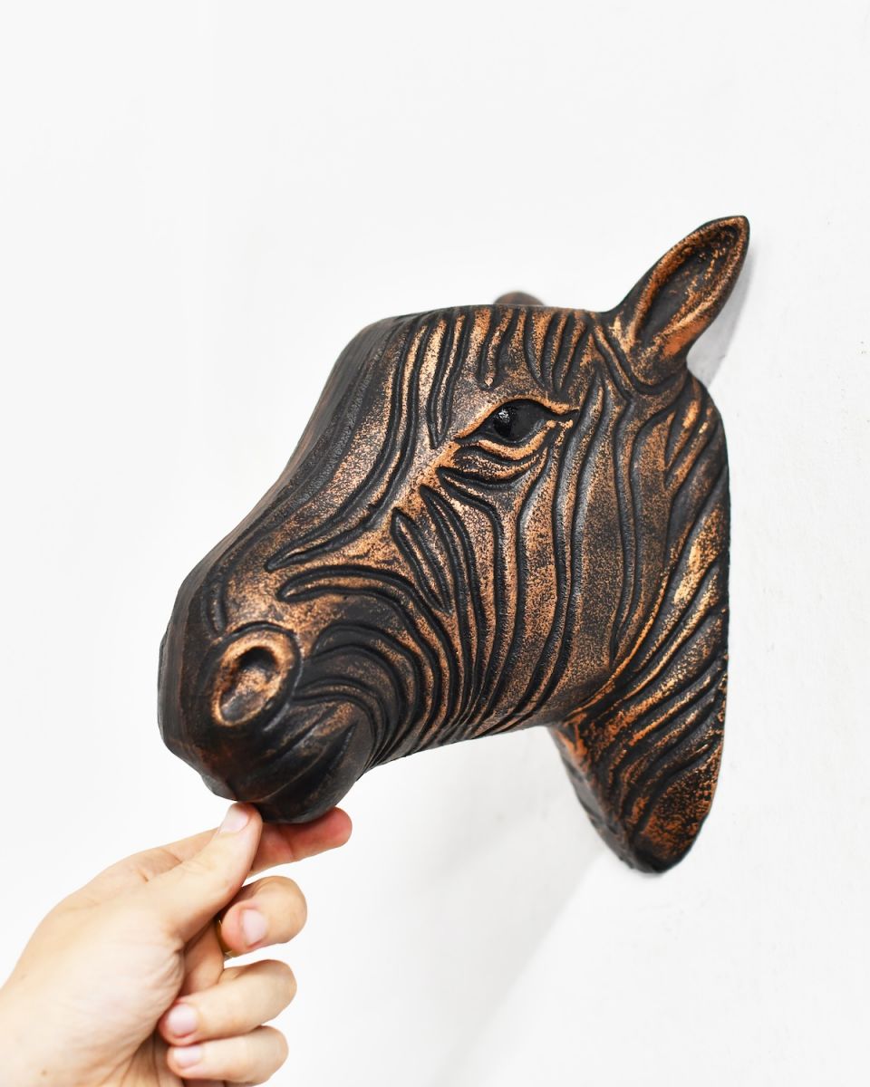 Scale image of copper animal head wall bust