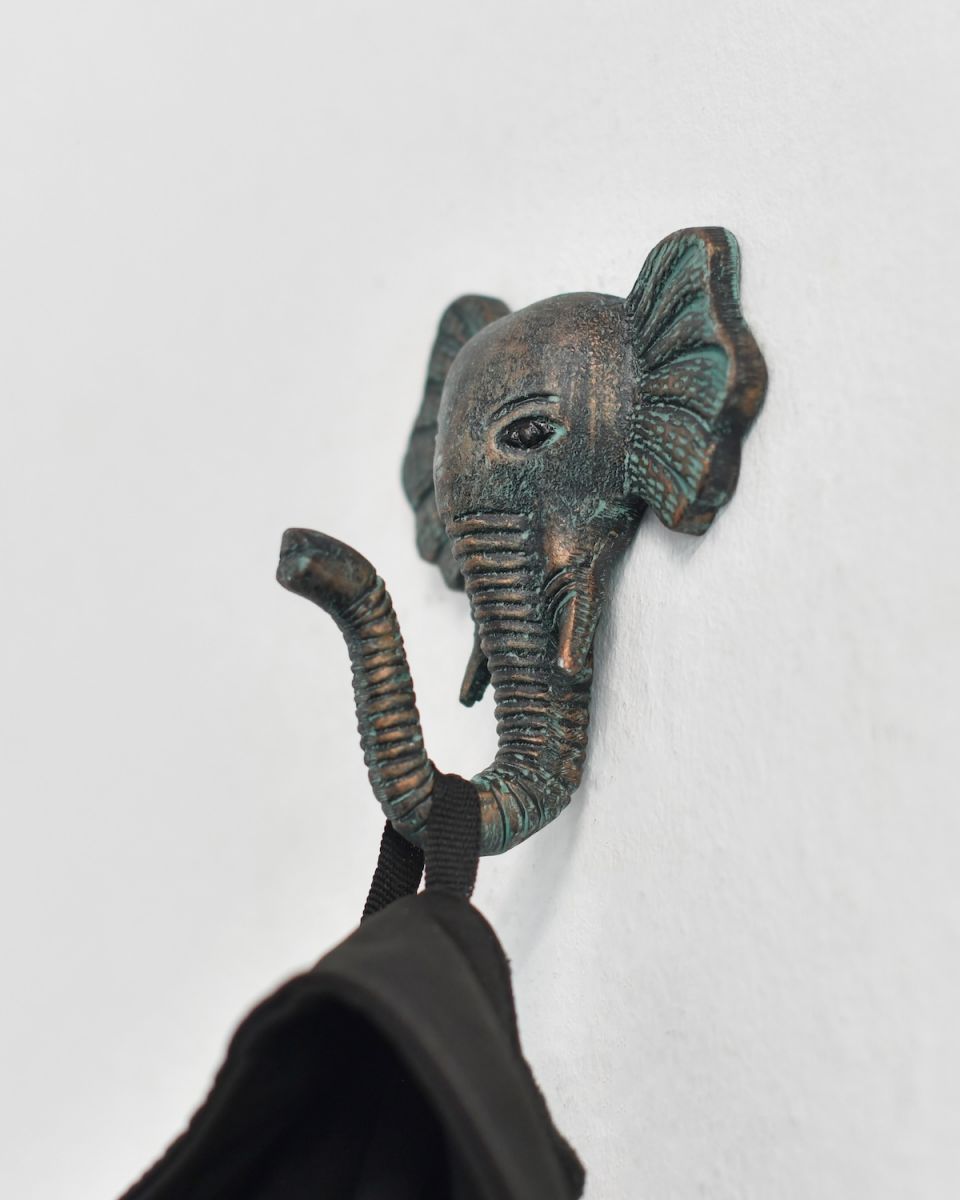 In situ photo of verdigris animal coat hook