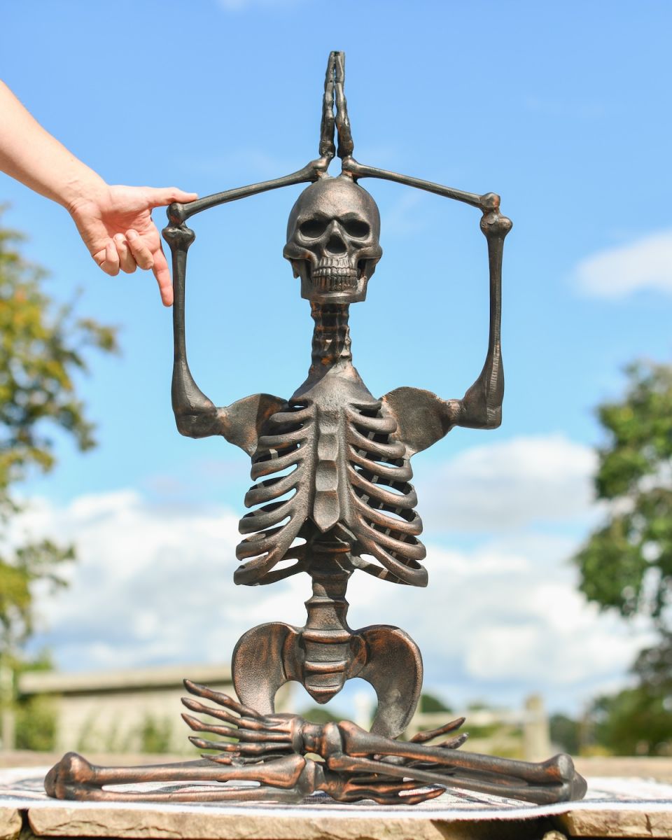 Scale image of bronze outdoor skeleton statue