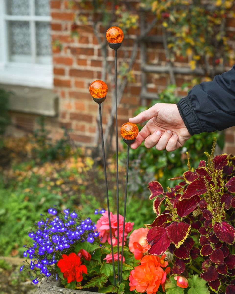 Scale image of orange suncatcher plant pot stakes