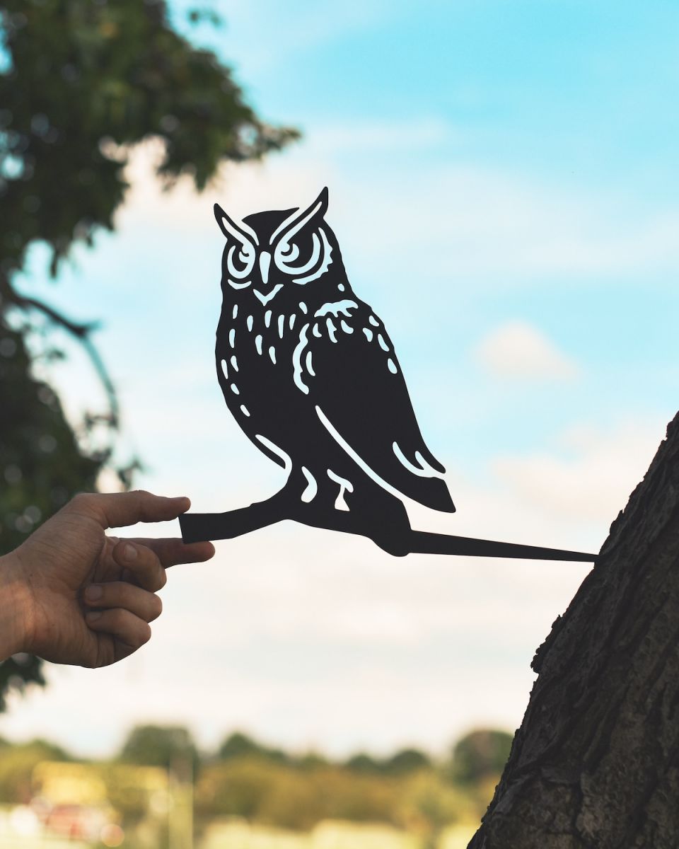 Scale image of metal owl tree spike Scale image of metal owl tree spike