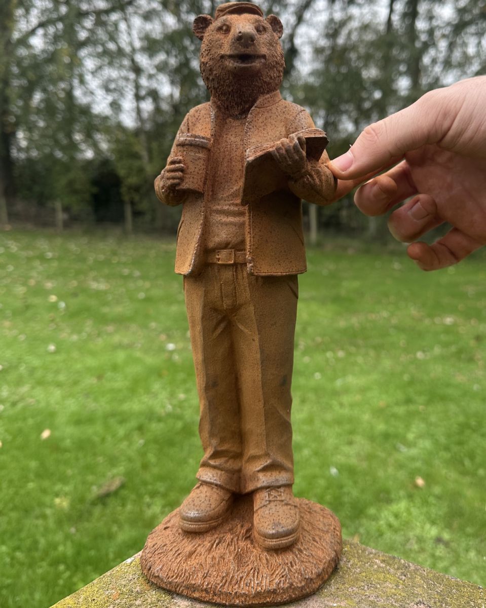 Scale image of rustic cast iron bear garden sculpture