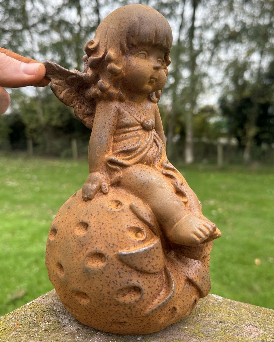 Scale image of rustic cast iron young fairy with strawberry garden sculpture Scale image of rustic cast iron young fairy with strawberry garden sculpture