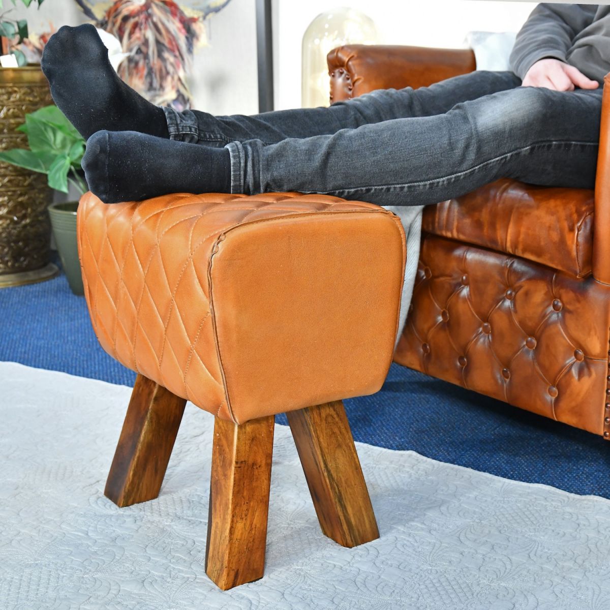 Scale image of tan leather stool