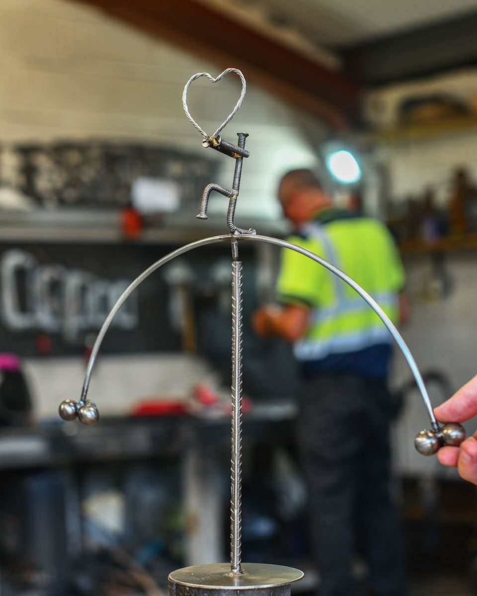 Scale image of "The Proposal" Recycled Metal Sculpture Scale image of "The Proposal" Recycled Metal Sculpture