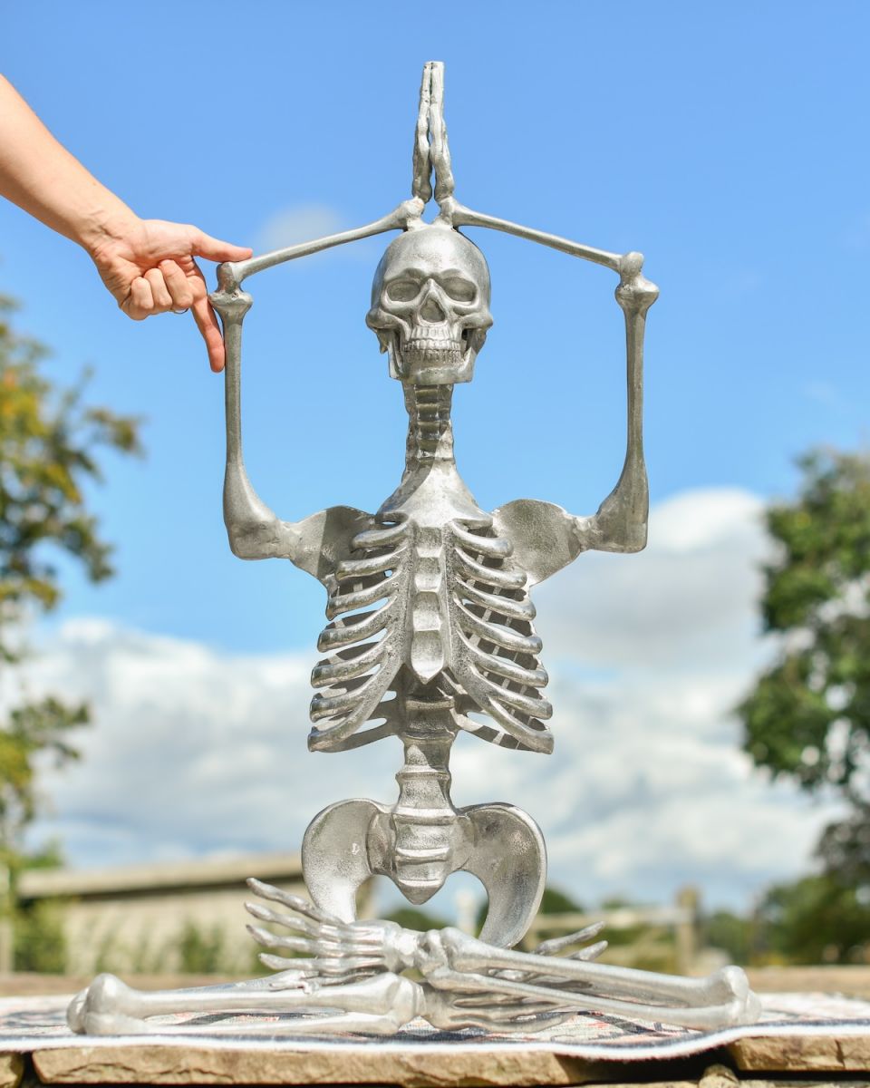 Scale image of skeleton garden statue