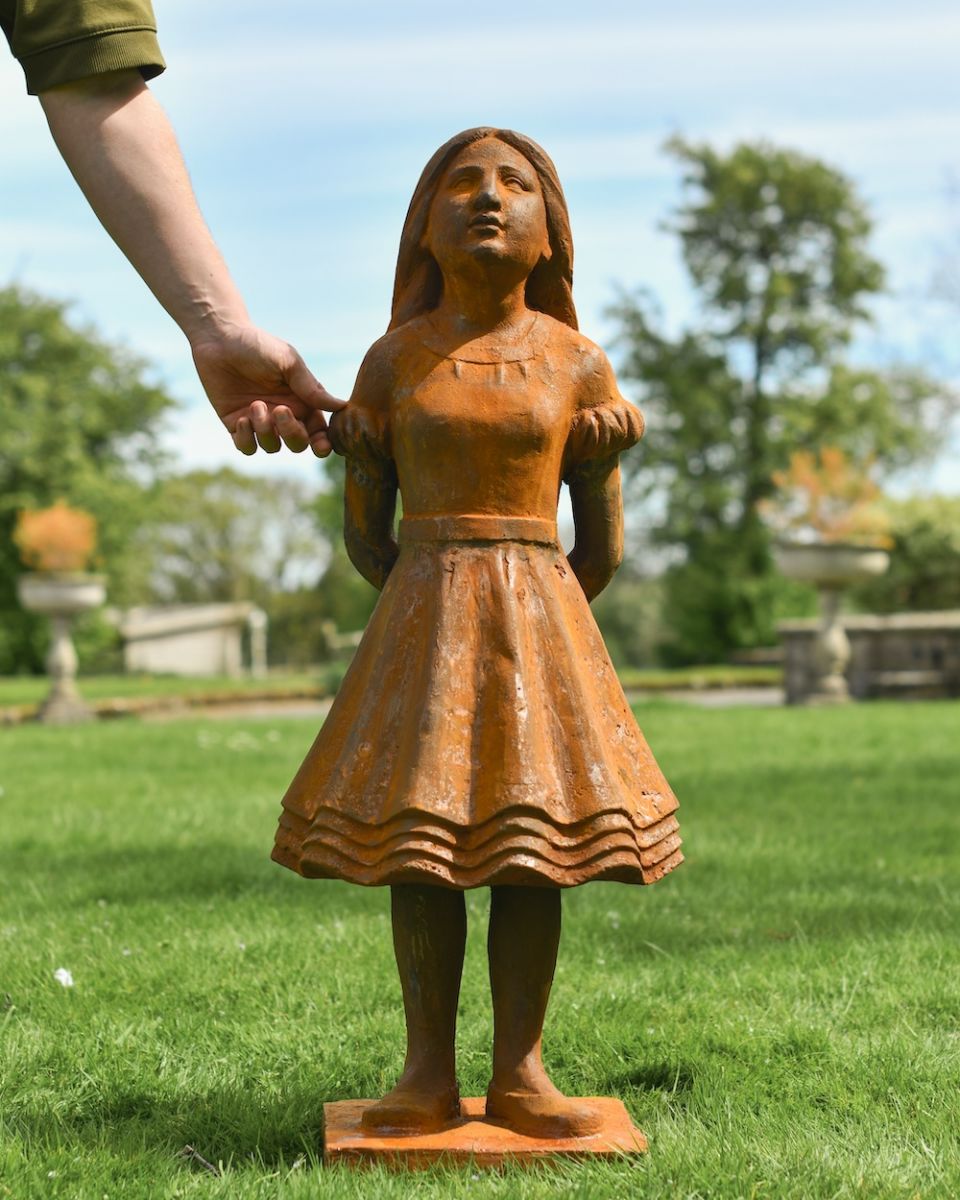 scale image of daydreaming rustic patio sculpture