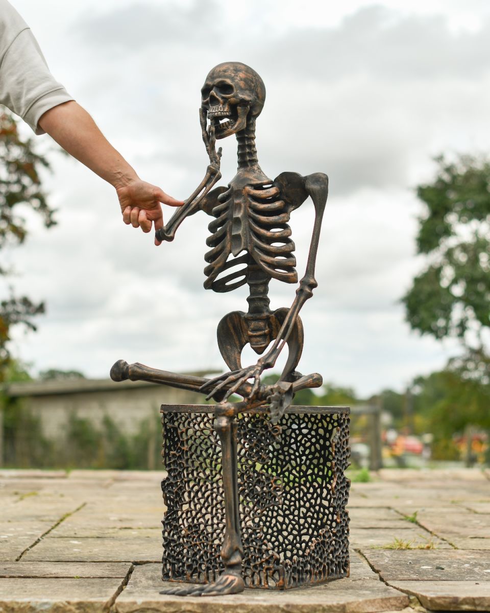 Scale image of skeleton outdoor sculpture