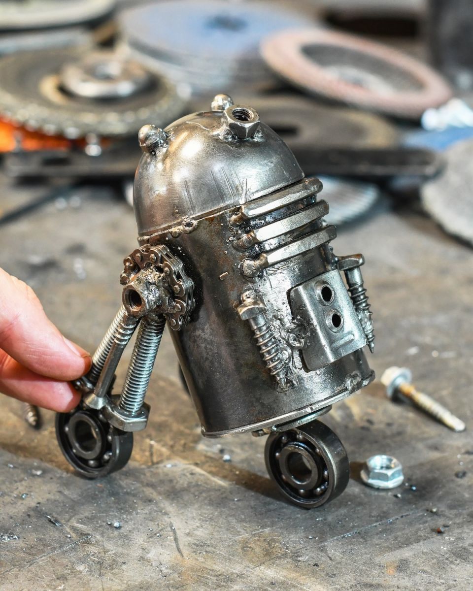 Scale of recycled metal art sculpture