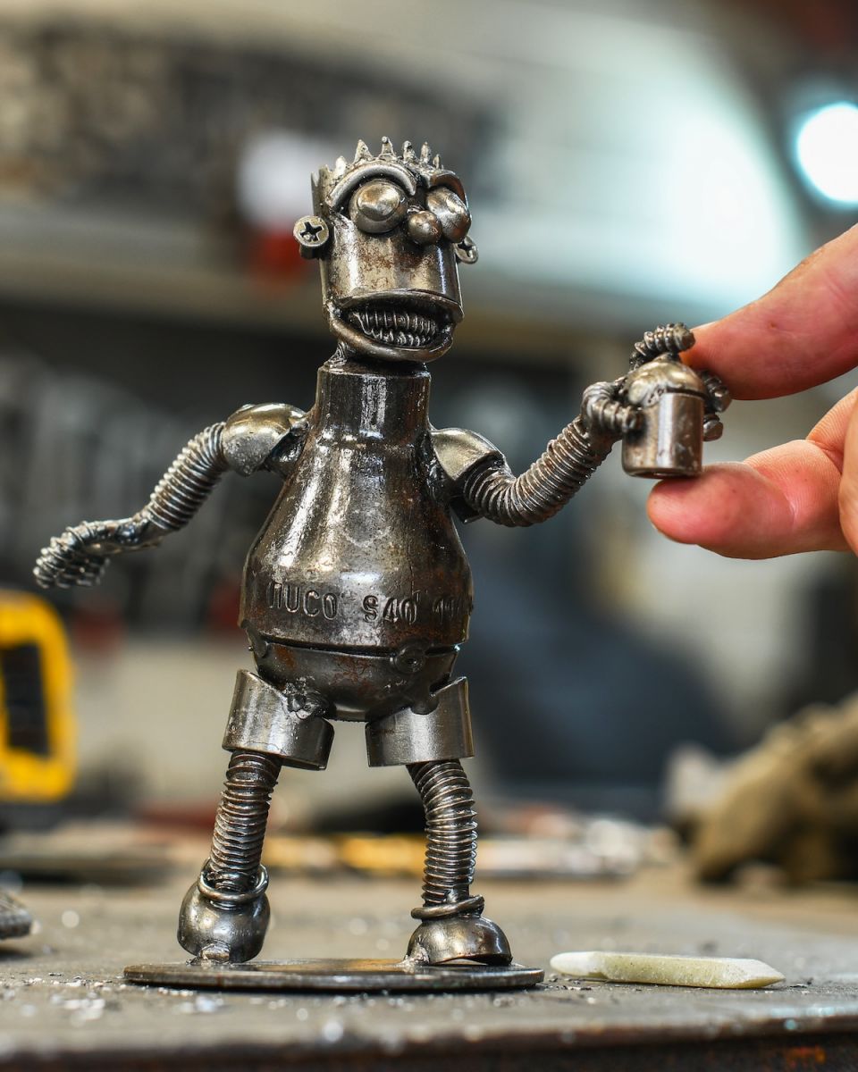 Scale image of recycled metal home decor sculpture