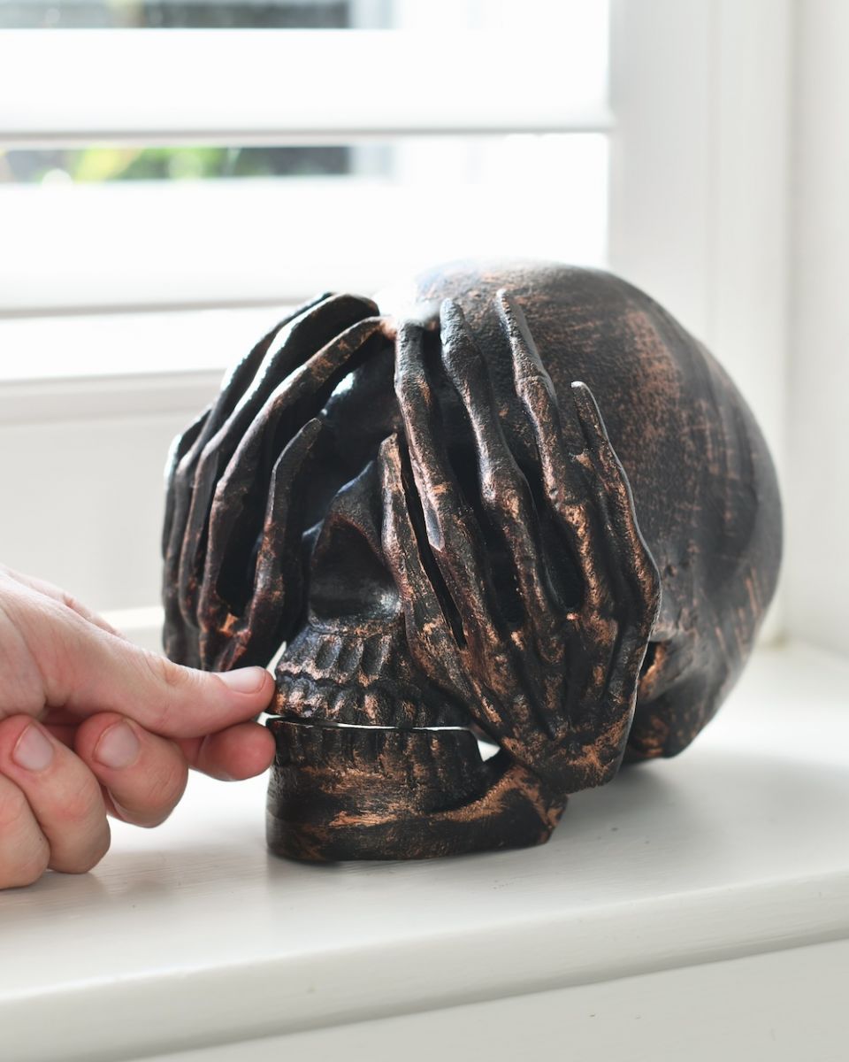 scale of bronze skull ornament