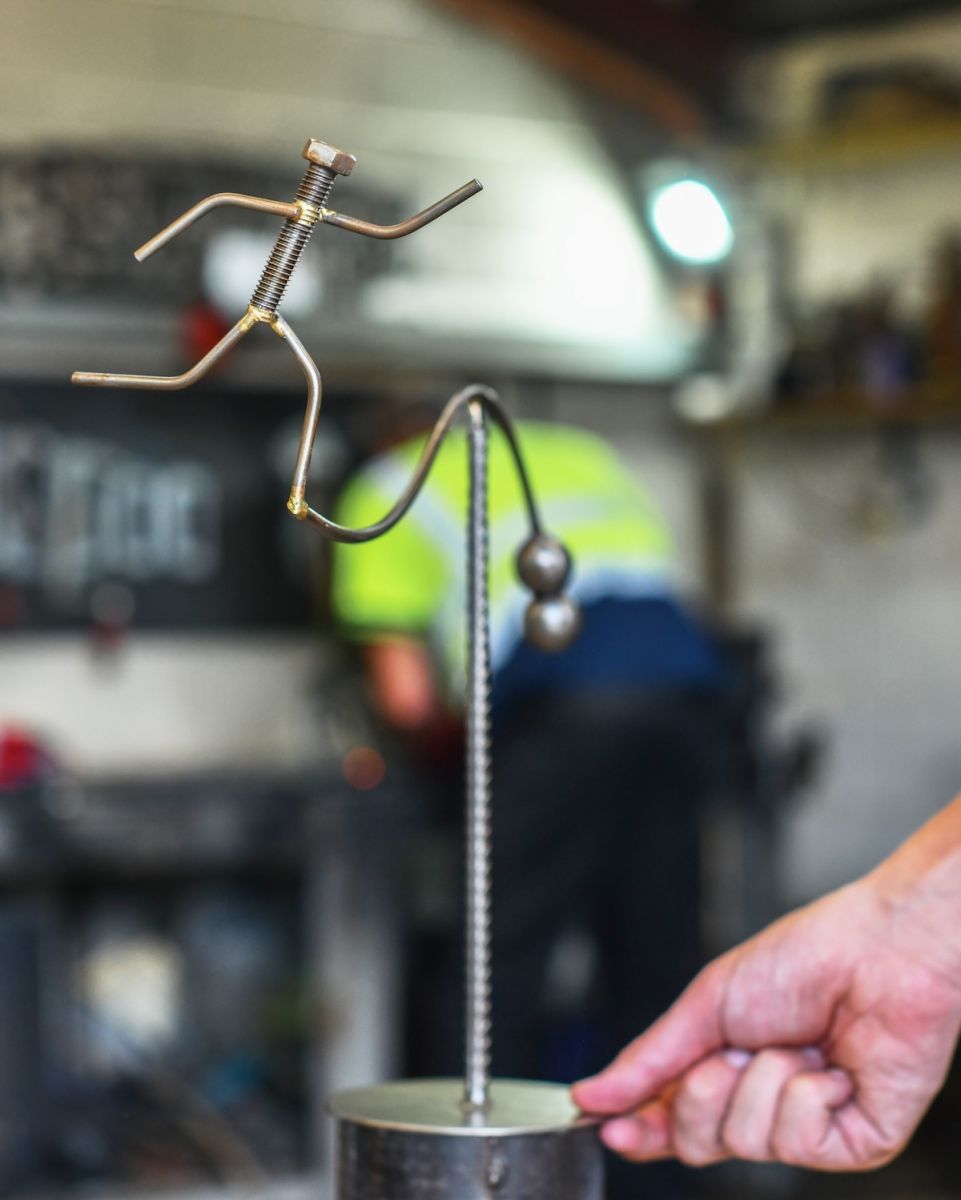 Scale image of "The Runner" Recycled Metal Sculpture