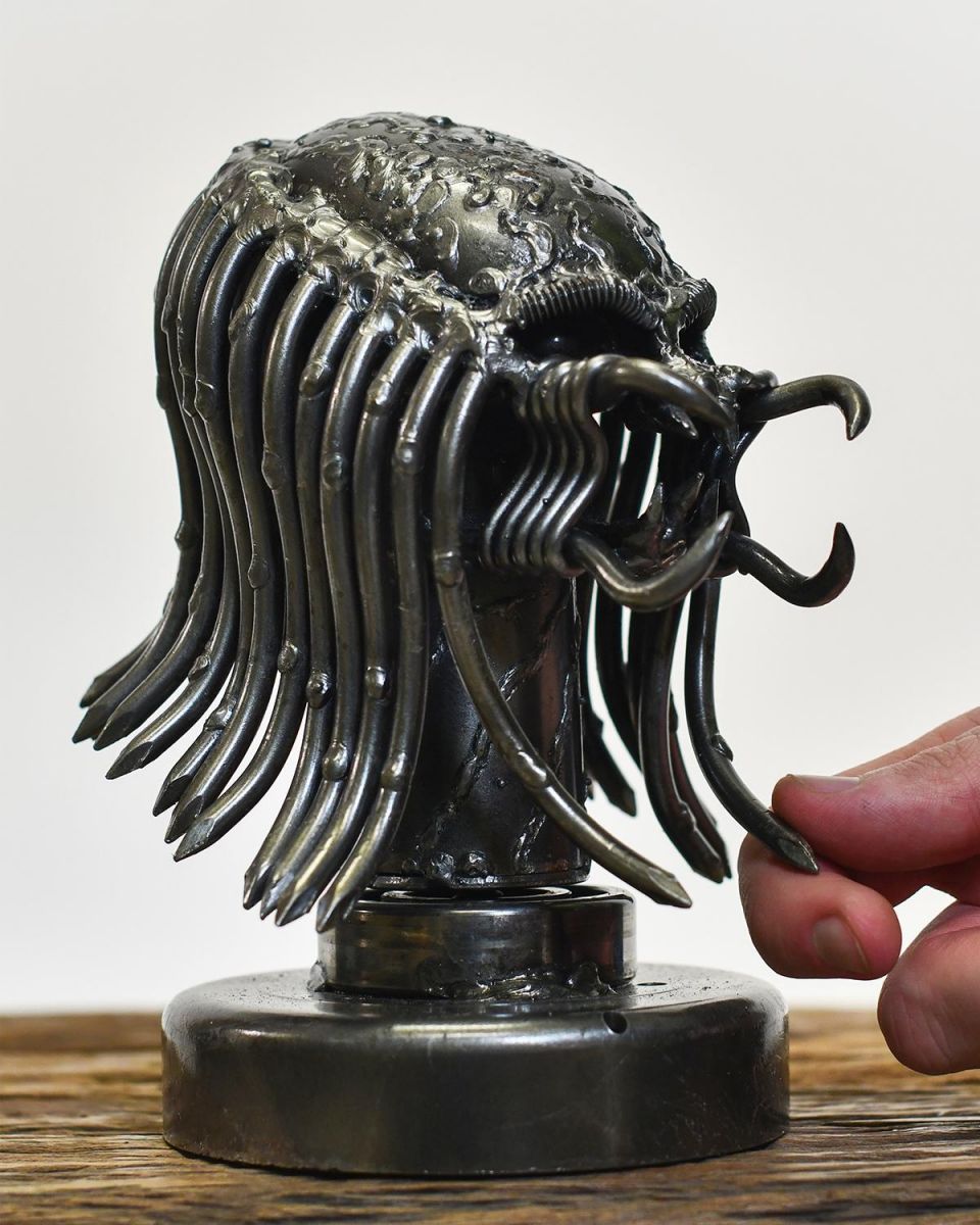 Scale Shot Of Metal Alien Head Sculpture Scale Shot Of Metal Alien Head Sculpture